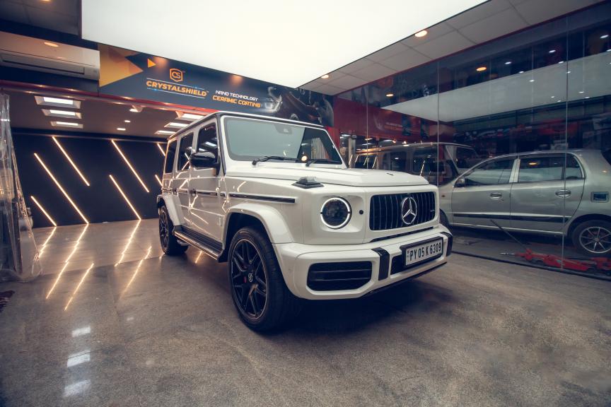 Mercedes SUV receiving ceramic coating treatment at car detailing center